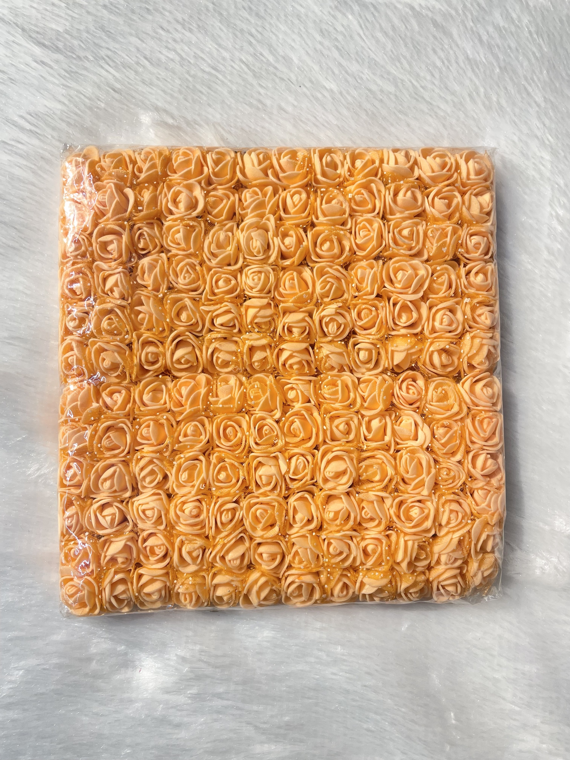 Orange foam flower (144 pieces)

Size-1.5cm